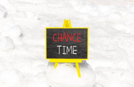Chance time symbol. Concept word Chance time on beautiful black blackboard. Beautiful white snow background. White snow. Black blackboard. Business chance time concept. Copy space.の写真素材