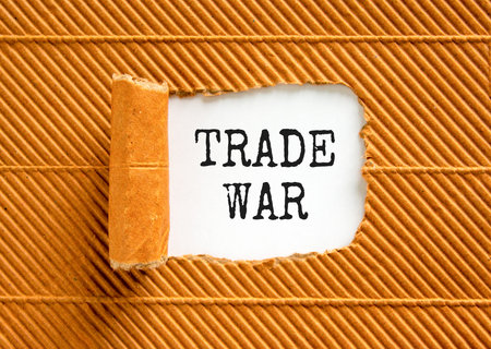 Trade war symbol. Concept word Trade war on beautiful white paper. Beautiful brown paper background. Business trade war concept. Copy space.の写真素材