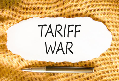 Trade tariff war symbol. Concept word Tariff war on beautiful white paper. Beautiful canvas background. Black pen. Business trade tariff wars concept. Copy space.の写真素材