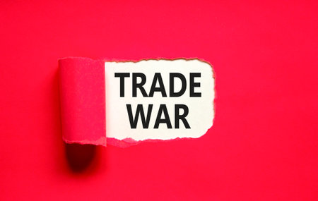 Trade war symbol. Concept word Trade war on beautiful white paper. Beautiful red paper background. Business trade war concept. Copy space.の写真素材