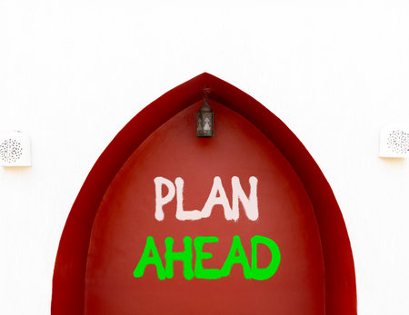 Plan ahead symbol. Concept word Plan ahead on beautiful white and red wall. Beautiful white and red wall background. Business plan ahead concept. Copy space.の写真素材