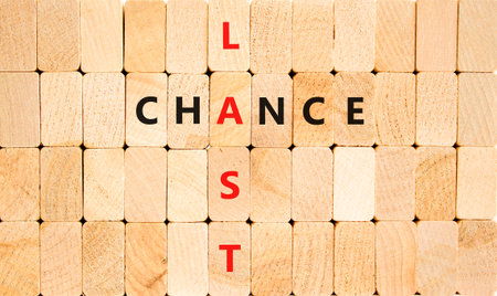 Last chance symbol. Concept word Last chance on beautiful wooden block wall. Beautiful wooden block wall background. Wooden blocks. Business last chance concept. Copy space.の写真素材