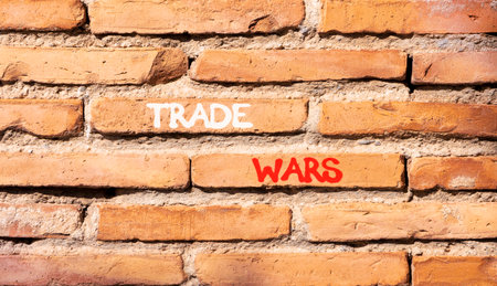 Trade wars symbol. Concept word Trade wars on beautiful old brown brick wall. Beautiful old brown brick wall background. Old brick wall. Business trade wars concept. Copy space.の写真素材