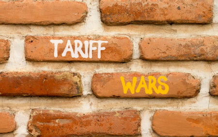 Trade tariff wars symbol. Concept word Tariff wars on beautiful old brown brick wall. Beautiful old brown brick wall background. Old brick wall. Business trade tariff wars concept. Copy space.の写真素材