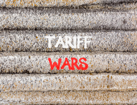 Trade tariff wars symbol. Concept word Tariff wars on beautiful gray mountain wall. Beautiful gray mountain wall background. Business trade tariff wars concept. Copy space.の写真素材
