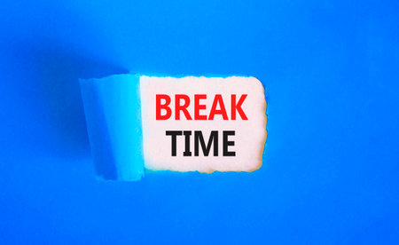 Break time symbol. Concept Break word time on beautiful white paper. Beautiful blue paper background. Business break time concept. Copy space.の写真素材