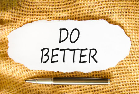 Do better symbol. Concept words Do better on beautiful white paper. Beautiful canvas background. Beautiful metallic pen. Business and do better concept. Copy space.の写真素材