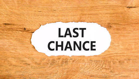 Last chance symbol. Concept word Last chance on beautiful white paper. Beautiful wooden paper background. Business last chance concept. Copy space.