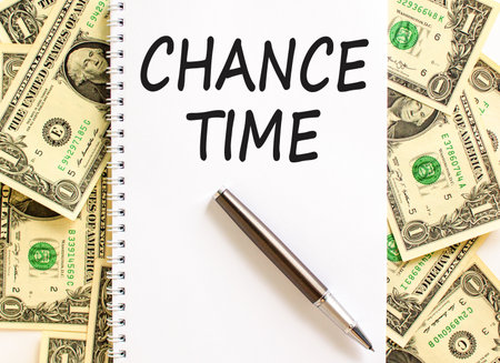 Chance time symbol. Concept word Chance time on beautiful white note. Dollar bills. Beautiful dollar bills background. Black pen. Business chance time concept. Copy space.の写真素材