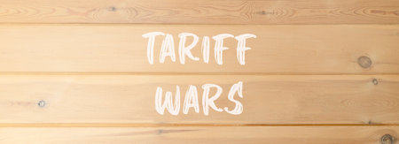 Trade tariff wars symbol. Concept word Tariff wars on beautiful wooden wall. Beautiful wooden wall background. Business trade tariff wars concept. Copy space.の写真素材
