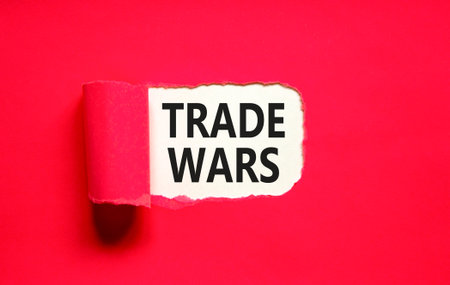 Trade wars symbol. Concept word Trade wars on beautiful white paper. Beautiful red paper background. Business trade wars concept. Copy space.の写真素材