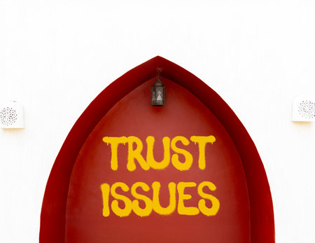 Trust issues symbol. Concept word Trust issues on beautiful white and red wall. Beautiful white and red wall background. Business trust issues concept. Copy space.の写真素材