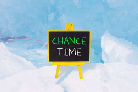Chance time symbol. Concept word Chance time on beautiful black blackboard. Beautiful blue Baikal ice and snow background. Black blackboard. Business chance time concept. Copy space.の写真素材