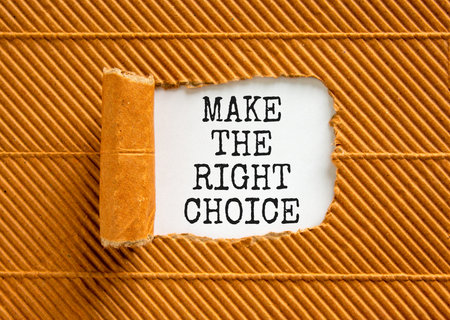 Make the right choice symbol. Concept words phrase Make the right choice on beautiful white paper. Beautiful brown paper background. Business Make the right choice concept. Copy space.の写真素材