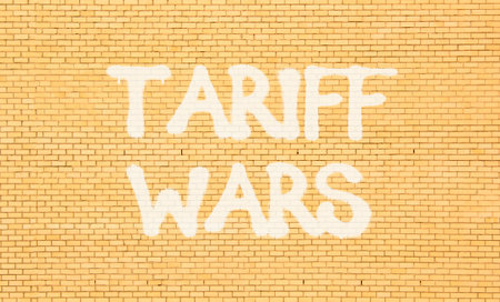 Trade tariff wars symbol. Concept word Tariff wars on beautiful brown brick wall. Beautiful brown...