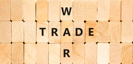 Trade war symbol. Concept word Trade war on beautiful wooden block wall. Beautiful wooden block wall background. Wooden blocks. Business trade war concept. Copy space.の写真素材