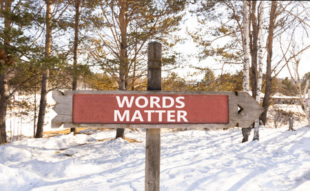Words matter symbol. Concept word Words matter on beautiful wooden road sign. Beautiful snow winter forest background. Business words matter concept. Copy space.の写真素材