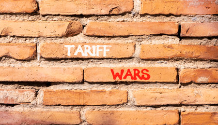 Trade tariff wars symbol. Concept word Tariff wars on beautiful old brown brick wall. Beautiful old brown brick wall background. Old brick wall. Business trade tariff wars concept. Copy space.の写真素材
