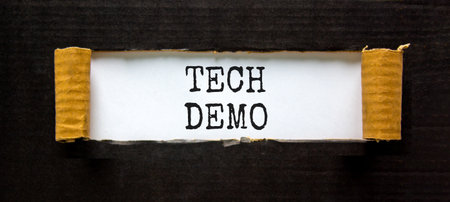Tech demo symbol. Concept word Tech demo on beautiful white paper. Beautiful black paper background. Business tech demo concept. Copy space.の写真素材