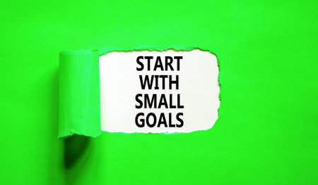 Start with small goals symbol. Concept words phrase Start with small goals on beautiful white paper....