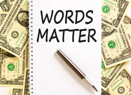 Words matter symbol. Concept word Words matter on beautiful white note. Dollar bills. Beautiful dollar bills background. Black pen. Business words matter concept. Copy space.の写真素材