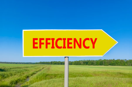Efficiency symbol. Concept word Efficiency on beautiful yellow road sign. Beautiful blue sky green grass and forest peaceful nature background. Business efficiency concept. Copy space.の写真素材