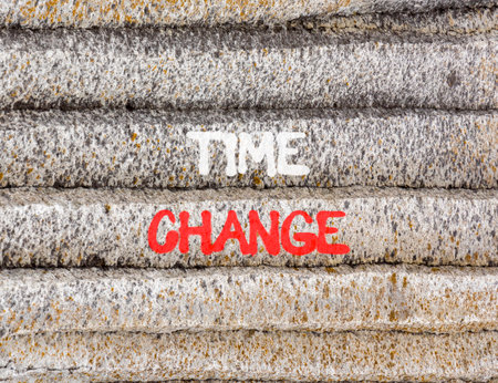 Time change symbol. Concept word Time change on beautiful gray mountain wall. Beautiful gray mountain wall background. Business time change concept. Copy space.の写真素材
