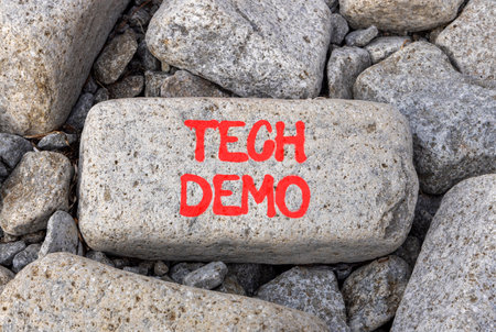 Tech demo symbol. Concept word Tech demo on beautiful gray stone on stone beach. Beautiful gray stone beach background. Business tech demo concept. Copy space.の写真素材