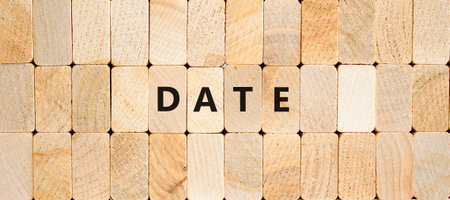 Date symbol. Concept word Date on beautiful wooden blocks. Beautiful wooden blocks background. Business and date concept. Copy space.の写真素材