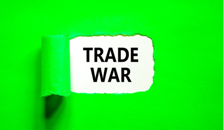 Trade war symbol. Concept word Trade war on beautiful white paper. Beautiful green paper background. Business trade war concept. Copy space.の写真素材