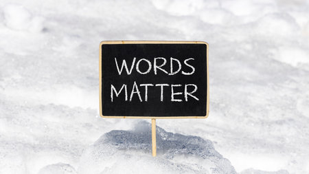 Words matter symbol. Concept word Words matter on beautiful black blackboard. Beautiful white snow background. White snow. Black blackboard. Business words matter concept. Copy space.の写真素材
