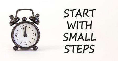 Start with small steps symbol. Concept words phrase Start with small steps on beautiful white paper....