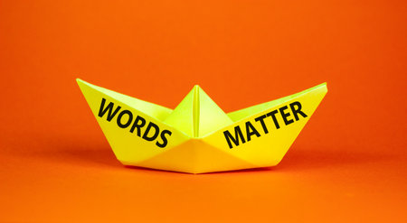 Words matter symbol. Concept word Words matter on beautiful yellow paper boat. Beautiful orange paper background. Business words matter concept. Copy space.の写真素材