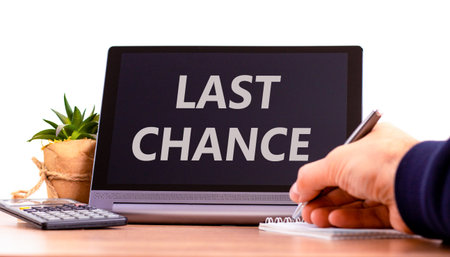Last chance symbol. Concept word Last chance on beautiful black tablet. Businessman's hand with pen. Calculator. Beautiful white background. Business last chance concept. Copy space.