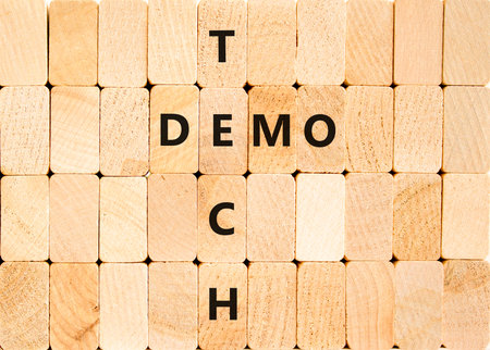 Tech demo symbol. Concept word Tech demo on beautiful wooden block wall. Beautiful wooden block wall...