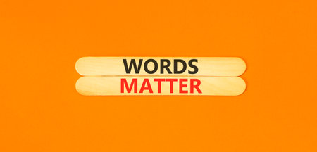 Words matter symbol. Concept word Words matter on beautiful wooden sticks. Beautiful orange paper...