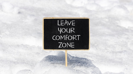 Leave your comfort zone symbol. Concept words Leave your comfort zone on beautiful black blackboard....
