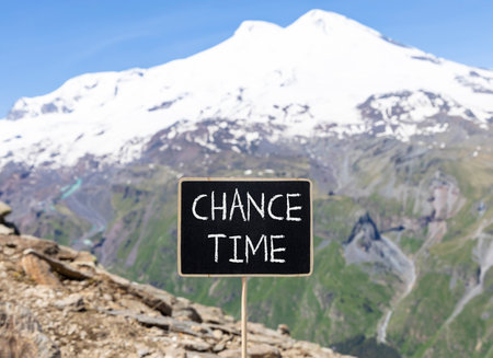 Chance time symbol. Concept word Chance time on beautiful black blackboard. Beautiful stone mountain...