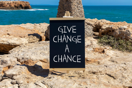 Give change a chance symbol. Concept words phrase Give change a chance on beautiful black...