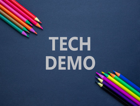 Tech demo symbol. Concept word Tech demo on beautiful black paper. Colored pencils. Beautiful black...