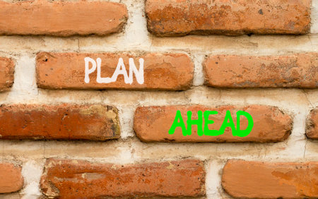 Plan ahead symbol. Concept word Plan ahead on beautiful old brown brick wall. Beautiful old brown...