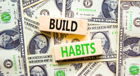 Build habits symbol. Concept word Build habits on beautiful wooden blocks. Beautiful dollar bills...