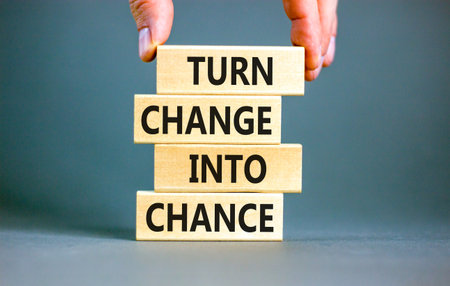 Turn change into chance symbol. Concept words phrase Turn change into chance on beautiful wooden...