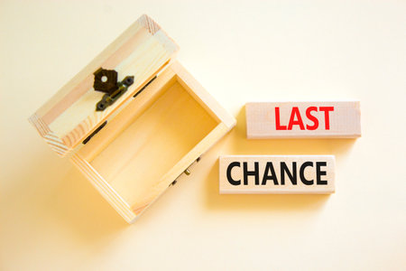 Last chance symbol. Concept word Last chance on beautiful wooden blocks. Beautiful white paper...