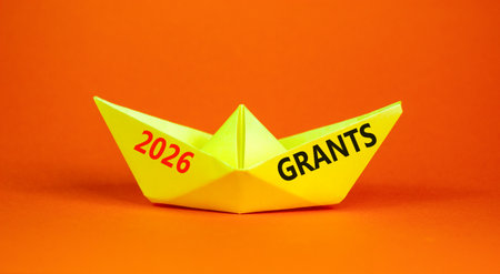 2026 Grants symbol. Concept words 2026 Grants on beautiful yellow paper boat. Beautiful orange paper...