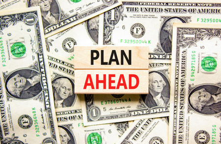 Plan ahead symbol. Concept word Plan ahead on beautiful wooden blocks. Dollar bills. Beautiful...