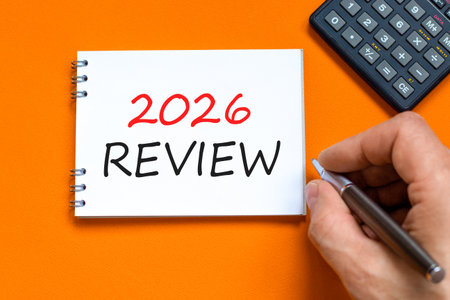2026 Review symbol. Concept words 2026 Review on beautiful white note. Black calculator. Beautiful...