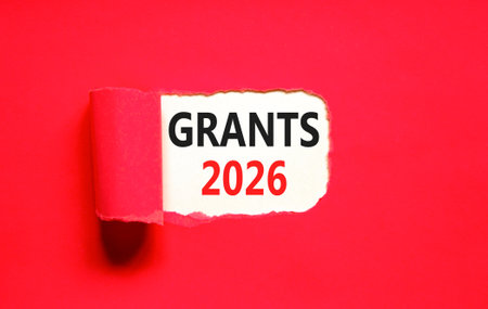 Grants 2026 symbol. Concept words Grants 2026 on beautiful white paper. Beautiful red paper...