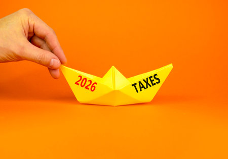 2026 taxes new year symbol. Concept words 2026 taxes on beautiful yellow paper boat. Beautiful...