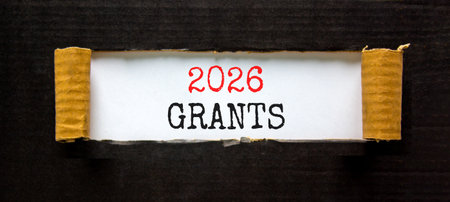 2026 Grants symbol. Concept words 2026 Grants on beautiful white paper. Beautiful black paper background. Business and 2026 grants concept. Copy space.の写真素材
